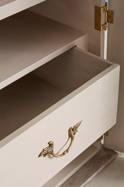 Hand-Carved Drawer Wardrobe in a light wood finish, close-up of an open drawer showing its wood interior and brass pull.