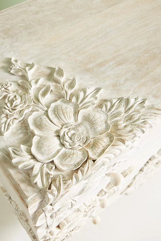 Hand-Carved Floral Vanity close-up of the top corner carving, featuring layered petals and leaves in whitewash finish.
