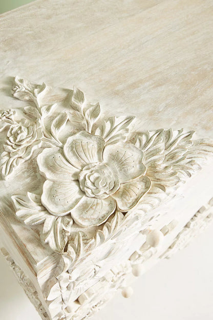 Hand-Carved Floral Vanity close-up of the top corner carving, featuring layered petals and leaves in whitewash finish.