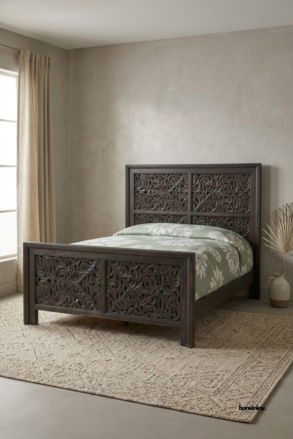 Hand-carved dark wood bed frame featuring intricate floral lattice scrollwork on both the high headboard and footboard panels. Artisan-crafted solid wood bed set styled with sage green floral bedding and a natural jute rug, perfect for bringing rustic luxury, vintage charm, and timeless craftsmanship to modern bedroom interiors.