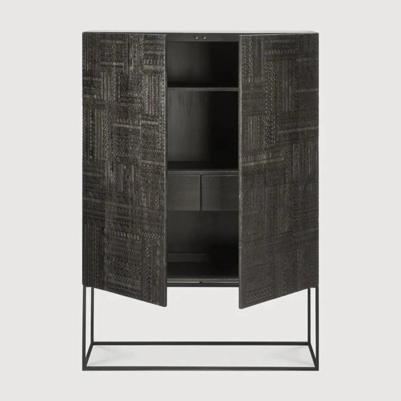 Hand-carved two-door cabinet in dark wood with a patchwork of geometric motifs, shown from the front