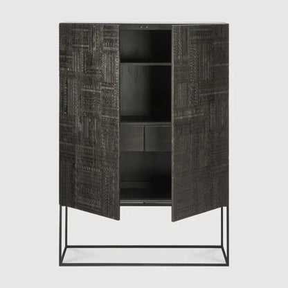 Hand-carved two-door cabinet in dark wood with a patchwork of geometric motifs, shown from the front
