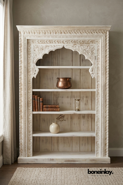 Whitewashed hand carved solid wood bookshelf with decorative arched frame and open shelves for displaying books and home décor.