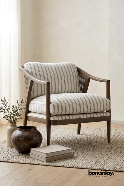Solid wood accent chair with striped upholstered cushions, curved wooden arms, and cane side panels for living room seating.
