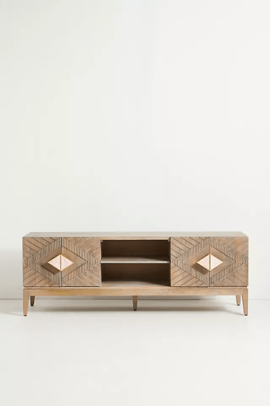 Hand carved Samuel media console in natural solid wood, front view with diamond-pattern doors and open center shelving.