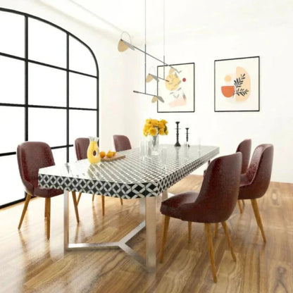 Handcrafted black and white bone inlay rectangular dining table with six upholstered chairs and metallic base in a modern dining room