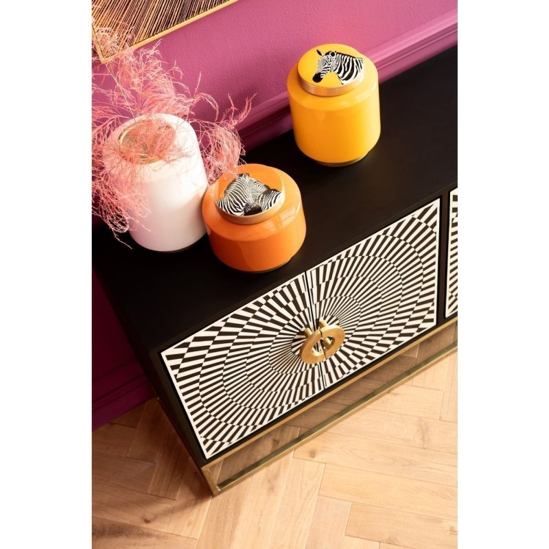 Handcrafted bone inlay buffet sideboard in black with four-door facade, bold starburst ivory inlay, brass ring hardware, and gold metal open base