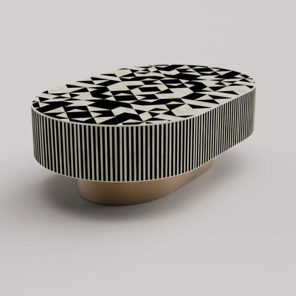 Handcrafted bone inlay oval table showing abstract geometric black white top pattern with striped apron and brass pedestal base