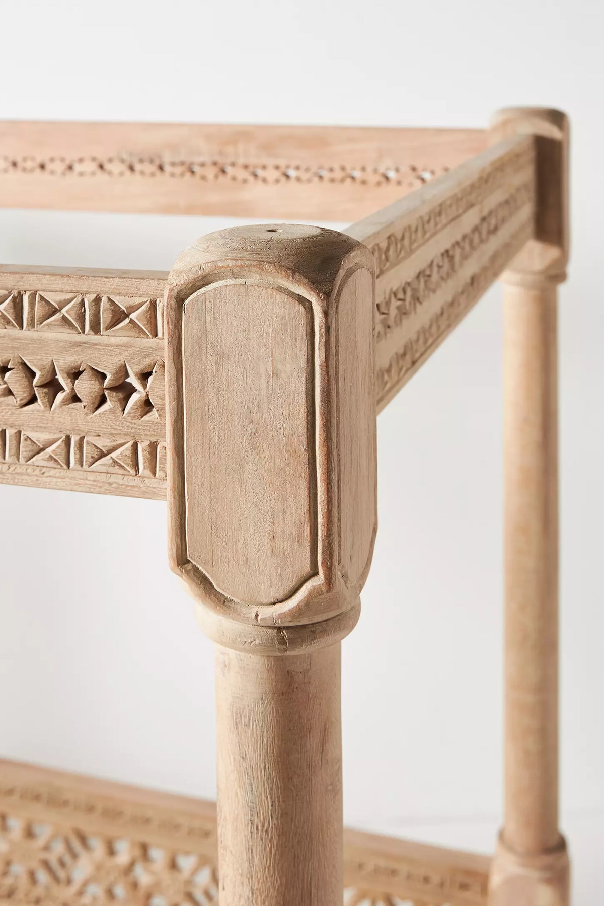 Handcrafted Ezana settee daybed with canopy posts, lattice woodwork, and spacious seating.