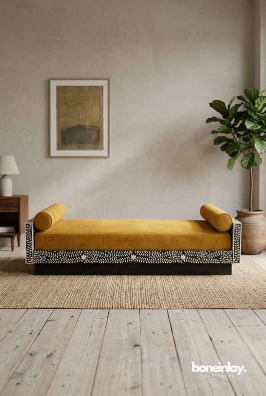 Handcrafted floral bone inlay daybed with mustard velvet cushion and bolster pillows in boho living room