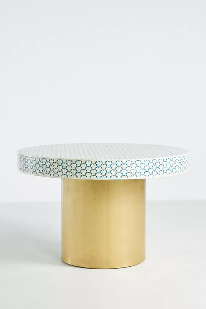 Handcrafted teal and white geometric bone inlay round dining table with gold metal pedestal base on white background