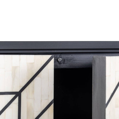 Interior construction detail of bone inlay sideboard showing open door hinge, handmade white inlay panel with black geometric linework and wooden frame