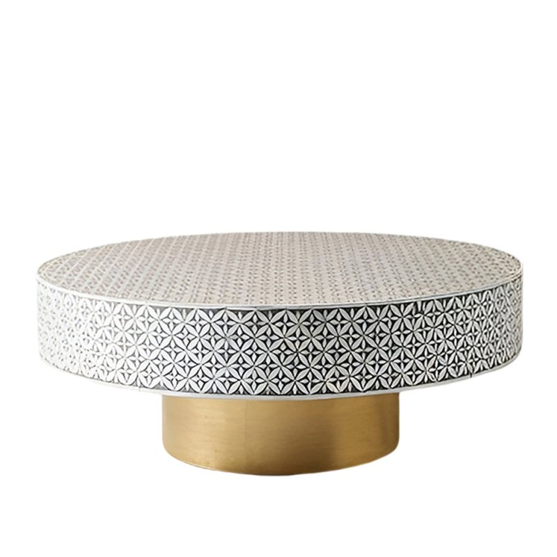 Handmade bone inlay geometric petal pattern circular coffee table with polished brass cylindrical stand on a clean white background, luxury decor