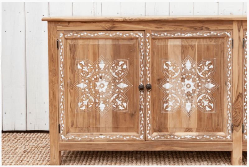Close-up of two doors on handmade teak wood inlay sideboard showing detailed white mandala bone inlay pattern and brass knobs