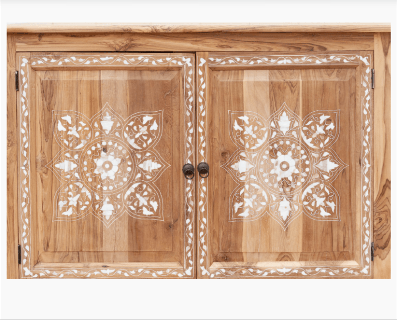 Extreme close-up of handmade teak wood inlay sideboard doors showing white bone inlay floral mandala pattern and brass knob