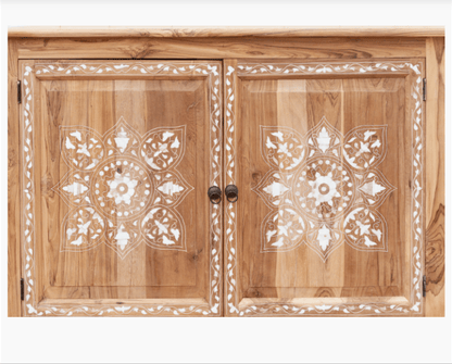 Extreme close-up of handmade teak wood inlay sideboard doors showing white bone inlay floral mandala pattern and brass knob