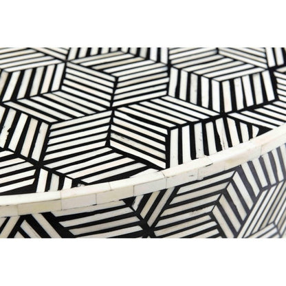 Close detail of black and white geometric cube bone inlay pattern on a handcrafted round coffee table showing intricate artisan inlay work