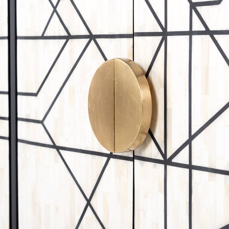 Circular antique brass pull handle on geometric bone inlay sideboard door, handcrafted monochrome white inlay with black linework detail