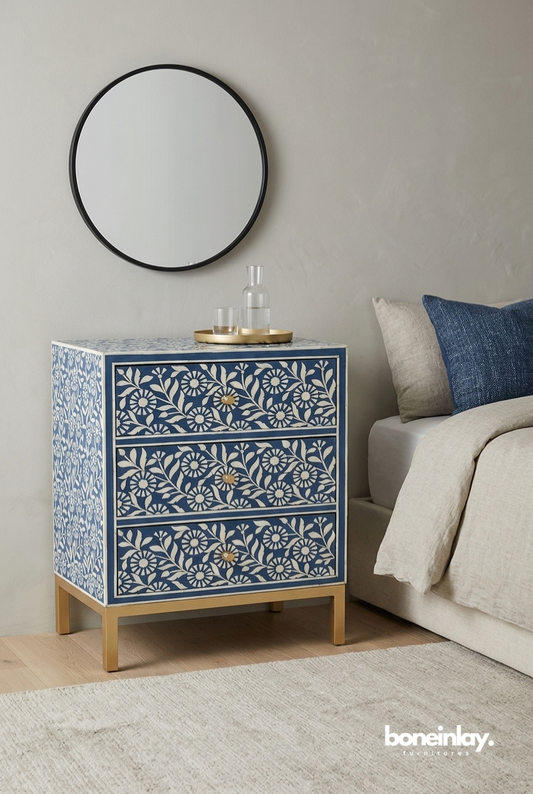 Handmade blue bone inlay Sunflora nightstand with 3 drawers, floral ivory pattern, and gold metal frame base in a styled bedroom