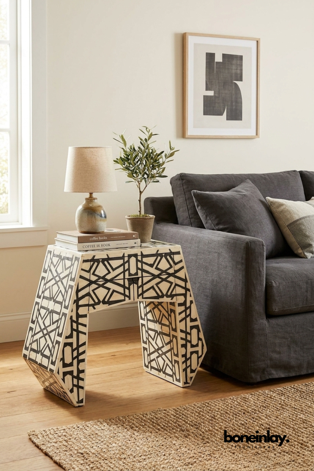 Black and white handmade bone inlay side table with an abstract geometric pattern, trapezoidal silhouette, and contemporary accent-table design.