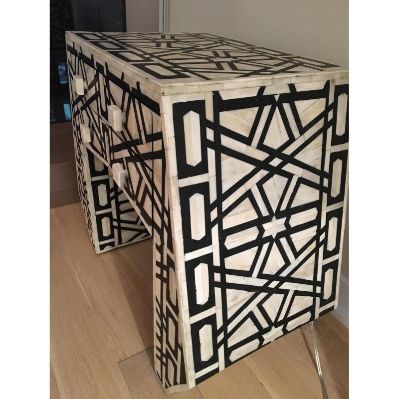 Black and white handmade bone inlay bedside table with an abstract geometric design, crisp contemporary lines, and functional drawer storage.