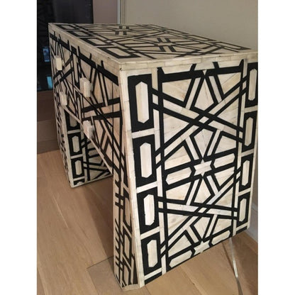 Black and white handmade bone inlay bedside table with an abstract geometric design, crisp contemporary lines, and functional drawer storage.