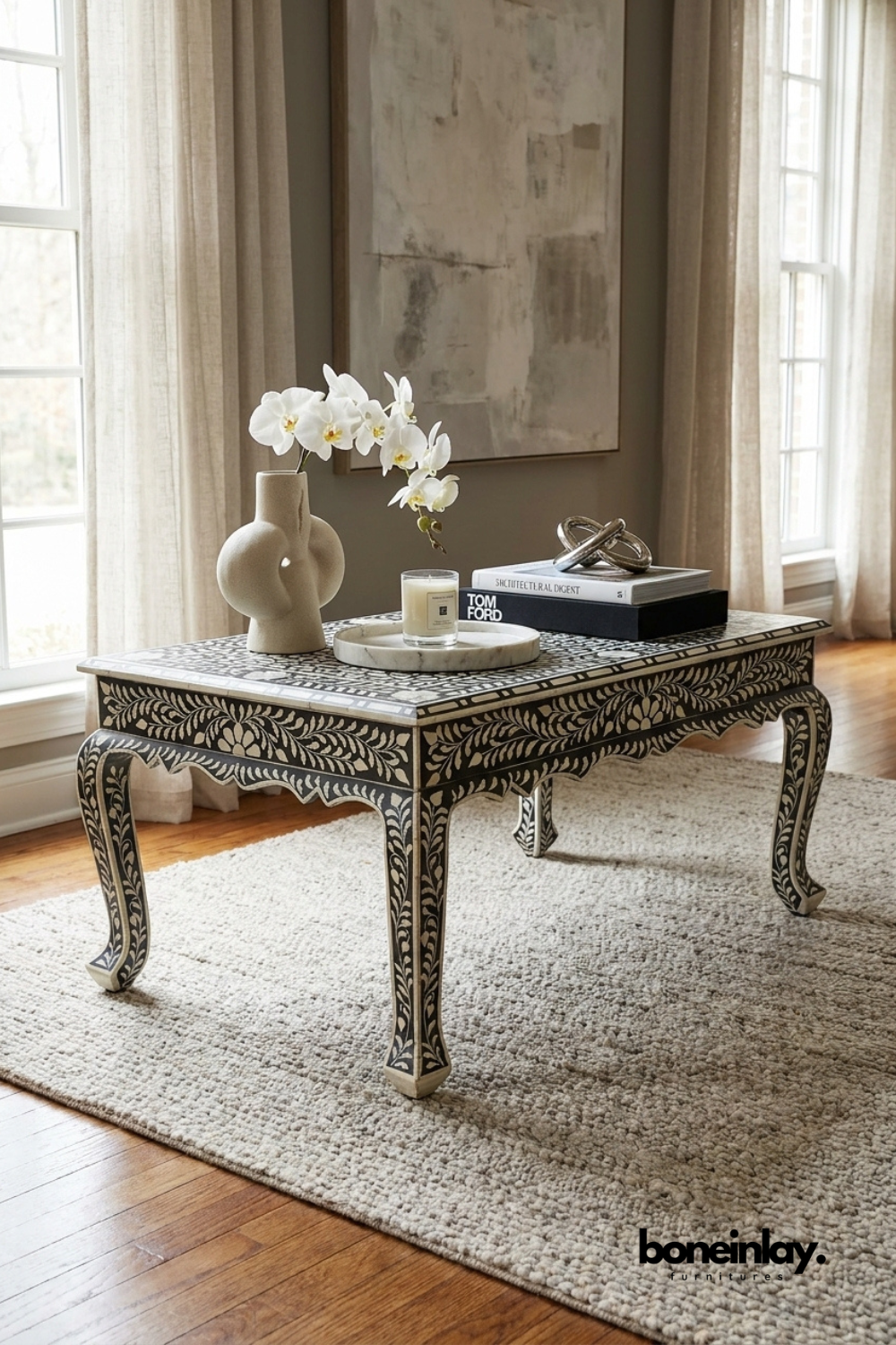 Black bone inlay coffee table with hand carved floral pattern and curved cabriole legs styled with decorative accents