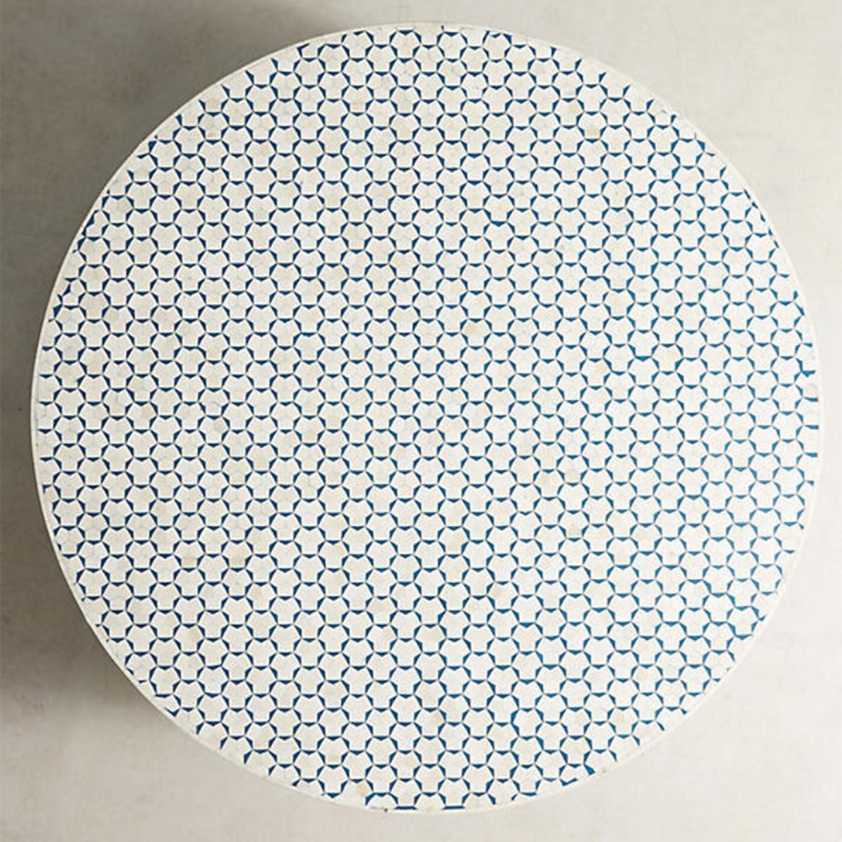Top view of the blue and white bone inlay occasional table, showing the complete circular tabletop with its repeating geometric inlay pattern, handcrafted bone surface, and contrasting blue-and-white Moroccan design details.