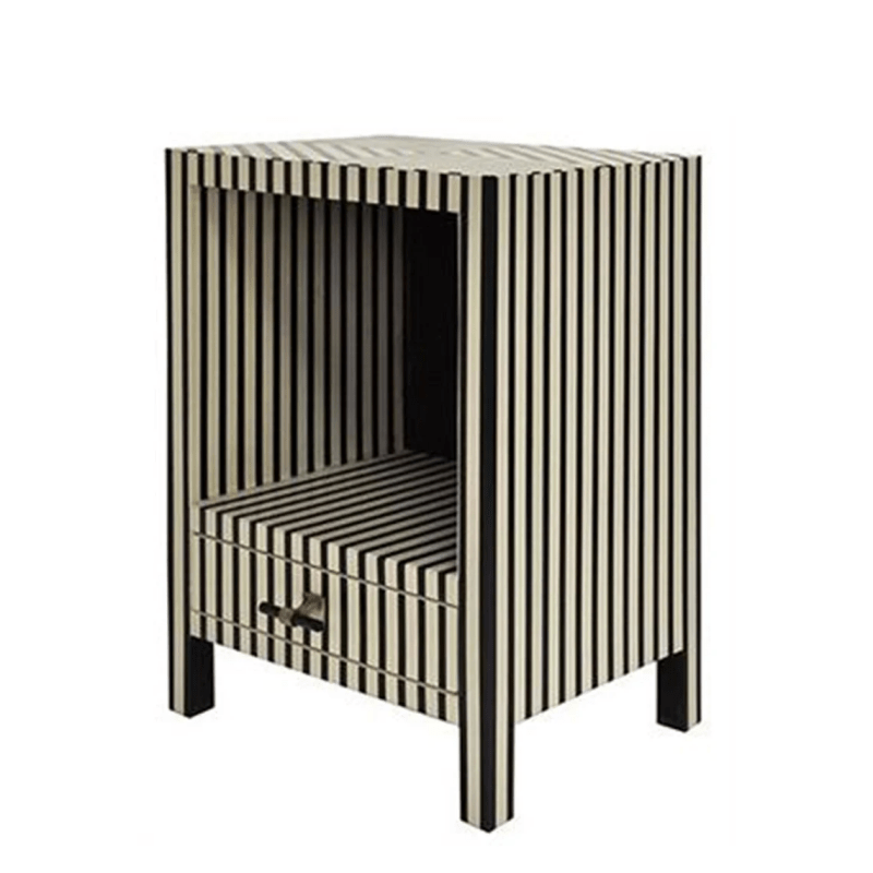 Angled view of a handmade bone inlay nightstand with bold vertical black and white stripes, open shelf compartment, and one bottom storage drawer