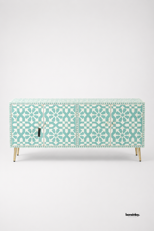 Artisan-crafted large 4-door credenza showcasing intricate Moroccan star geometric bone inlay patterns in refreshing turquoise seafoam green and white resin, elevated on slender brass legs. Displayed on a clean white studio backdrop, this luxury media console offers generous concealed storage, vibrant color, and exquisite handmade craftsmanship for modern homes.