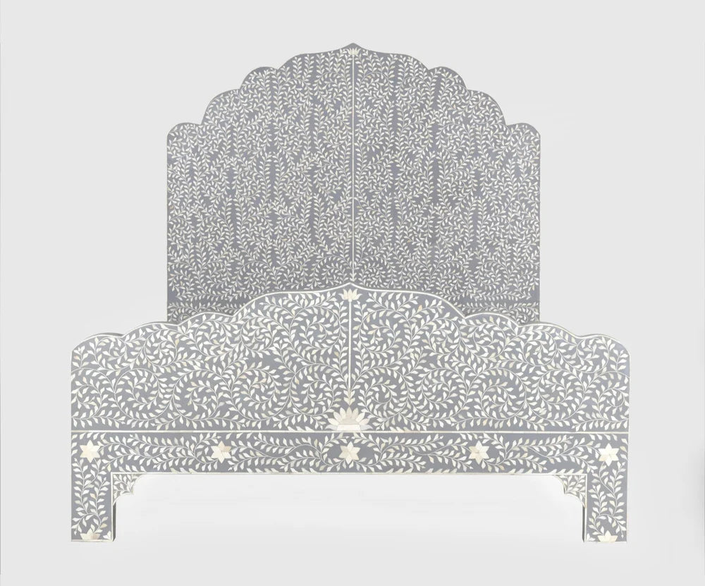 Front view of a king-size grey and white floral bone inlay bed with a scalloped crown headboard and footboard against a white background.