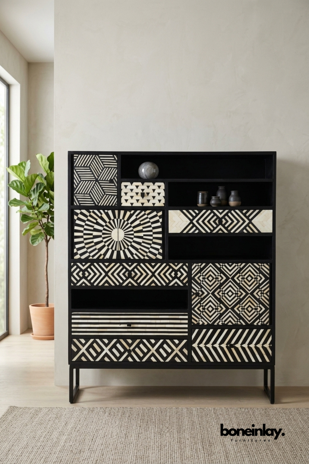 Black and white bone inlay curio cabinet featuring a striking patchwork of mixed geometric patterns across drawers and open shelving. Combines closed storage with display niches for books, sculptures, and decorative objects. Slim black metal legs complete the bold graphic silhouette. A dramatic statement cabinet for eclectic and maximalist living spaces.