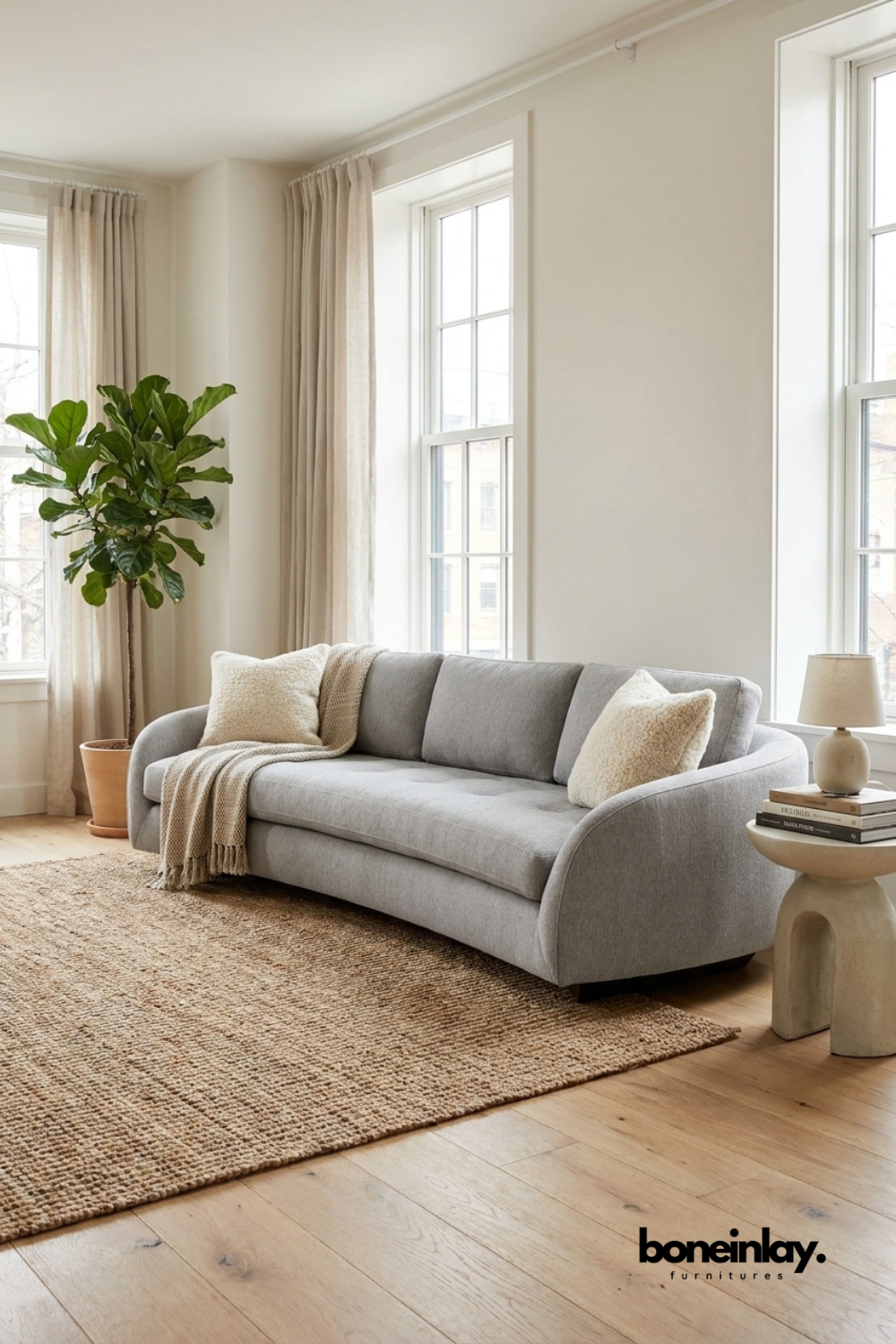Modern curved light grey upholstered sofa with rounded arms, contemporary living room couch, luxury fabric three seater sofa for home interior