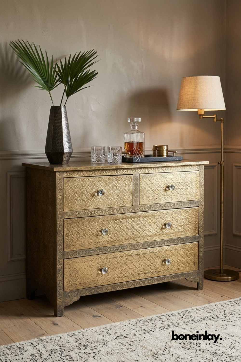 Handcrafted embossed brass chest of drawers featuring textured metal finish, crystal knobs, four spacious drawers, and luxurious solid wood bedroom storage cabinet.