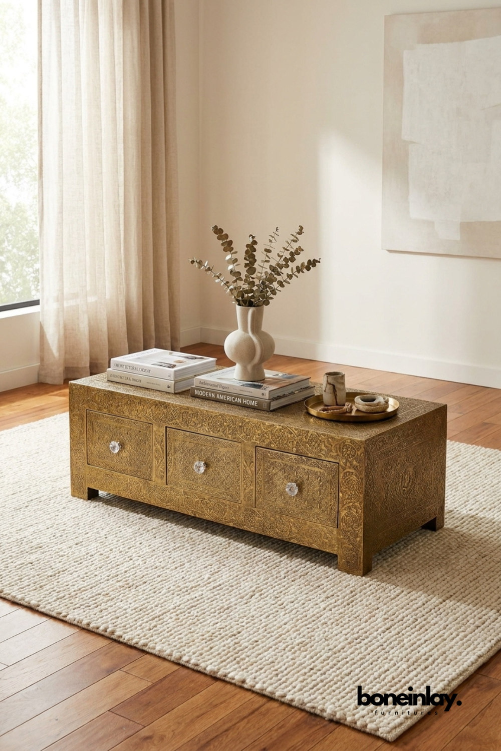 Antique brass embossed storage coffee table with three drawers and decorative engraved detailing