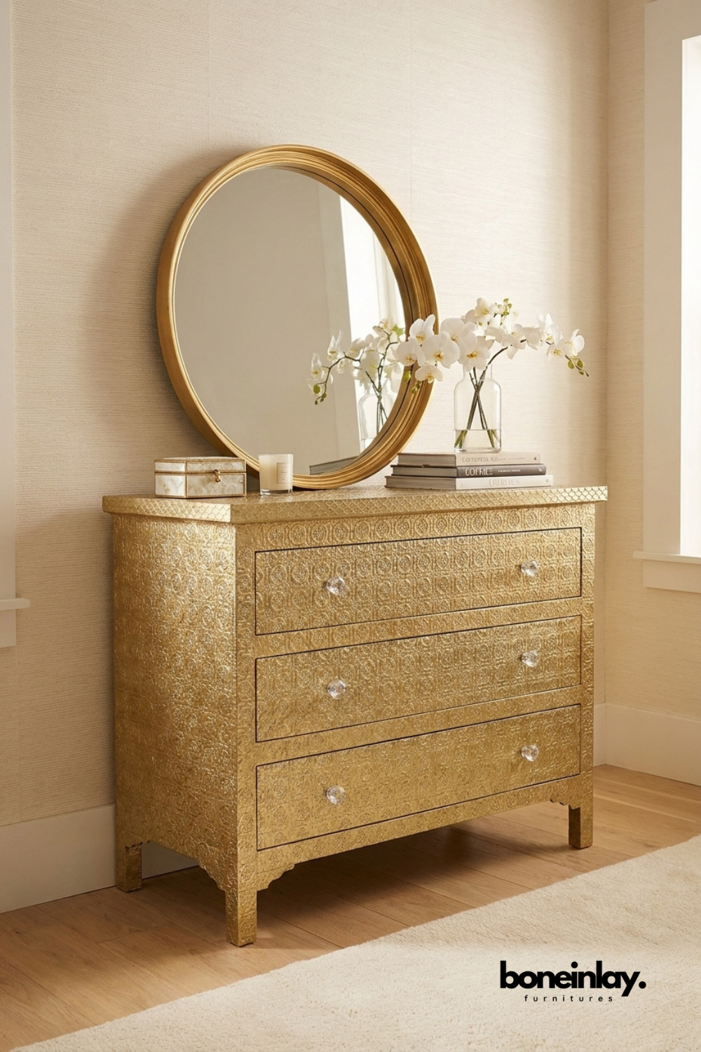 Handcrafted embossed brass chest of drawers featuring intricate floral engraved metal finish, crystal knobs, three spacious drawers, and luxurious bedroom storage furniture.