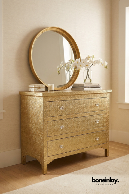 Handcrafted embossed brass chest of drawers featuring intricate floral engraved metal finish, crystal knobs, three spacious drawers, and luxurious bedroom storage furniture.