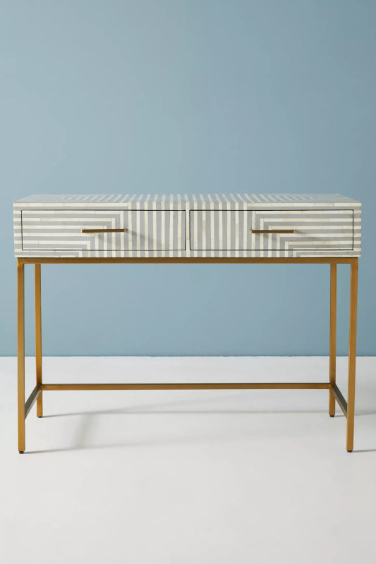 Handmade grey striped bone inlay console table with two drawers and gold metal legs on white floor