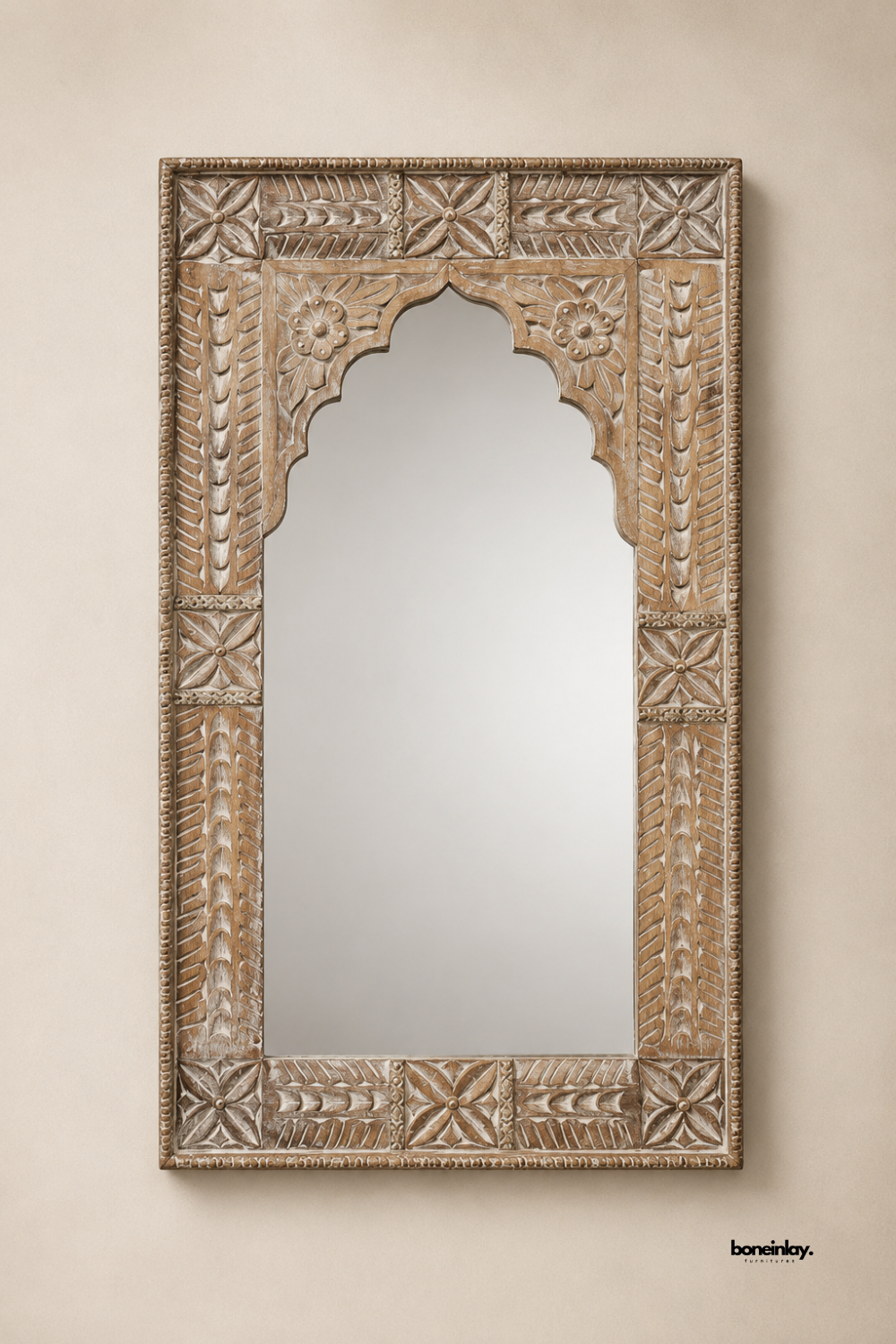 Artisan-crafted whitewashed solid wood rectangular mirror showcasing an ornate scalloped arch cutout and carved geometric leaf patterns. Displayed against a clean studio backdrop, this large decorative wall mirror brings authentic traditional craftsmanship and rustic bohemian charm to modern home decor.