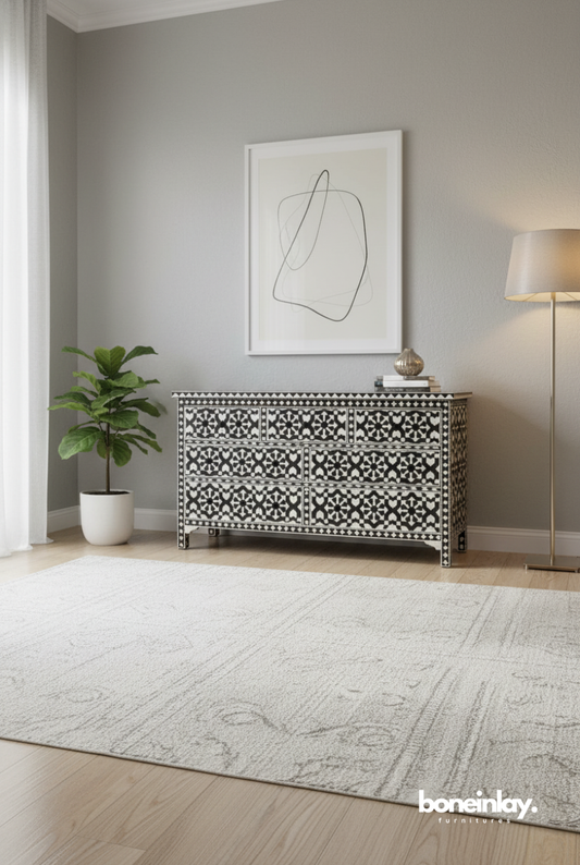 Handmade black and white Moroccan star bone inlay 7-drawer dresser styled in a modern living room with neutral decor and wooden flooring.