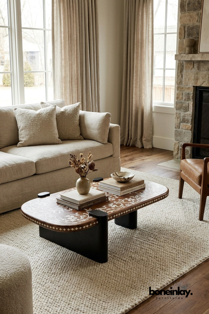Oval wooden coffee table with delicate white floral inlay design, unique artisan living room table, handcrafted statement furniture.