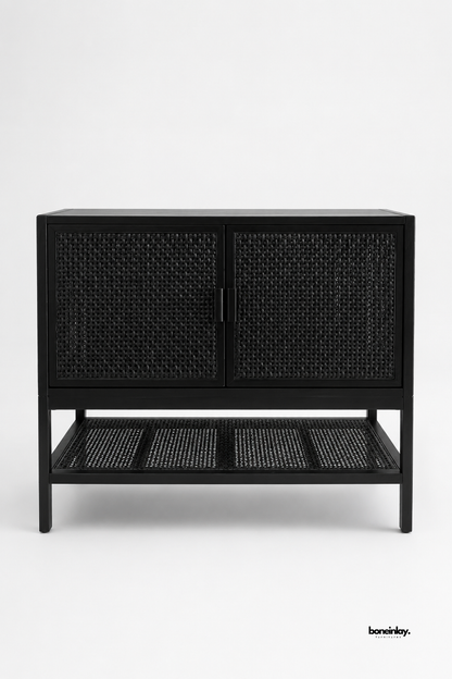 Artisan-crafted modern cabinet finished in sleek matte black with woven natural cane door fronts and an open bottom slatted cane storage shelf. Presented on a neutral studio background, this contemporary 2-door credenza seamlessly balances modern contrast with organic bohemian texture for living rooms, hallways, and dining areas.