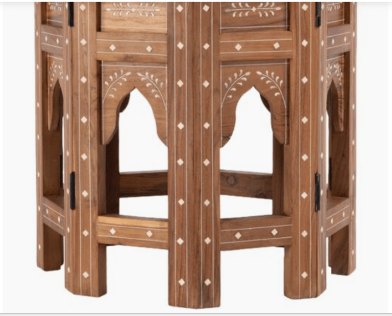 Hexagonal Bone Inlay Teak Wood Living Room Side Table placed beside a mustard accent chair, displaying the detailed bone inlay star pattern on the tabletop.