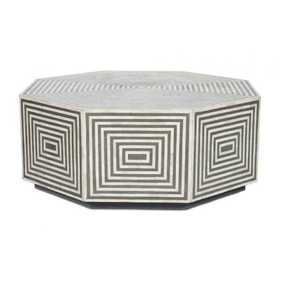 Straight front angle studio view of the grey and white bone inlay octagonal center table, showing all eight side panels with concentric square bone inlay, the fine striped inlay tabletop, and the recessed dark plinth base of this handmade low profile coffee table.