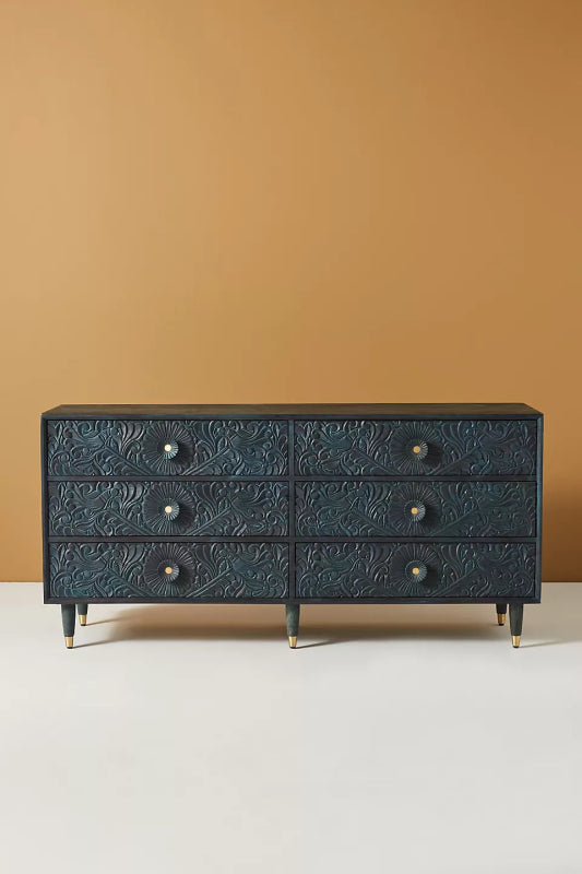 Full view of the indigo Gulliver six-drawer chest against a plain background, showing its carved drawer fronts.