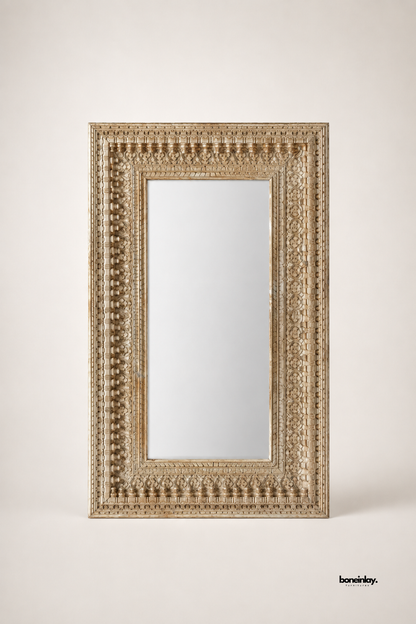 Artisan-crafted whitewashed solid wood rectangular mirror showcasing intricate hand-carved floral patterns and turned wooden peg detailing along the outer frame. Displayed against a clean studio background, this large decorative accent mirror delivers rustic charm, architectural depth, and premium quality for modern living spaces.