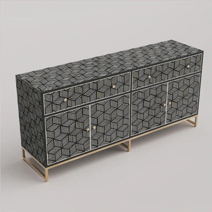 Angled perspective of large black bone inlay buffet cabinet showing geometric cube stripe pattern across top surface, front drawers, cabinet doors, and brushed brass metal base.