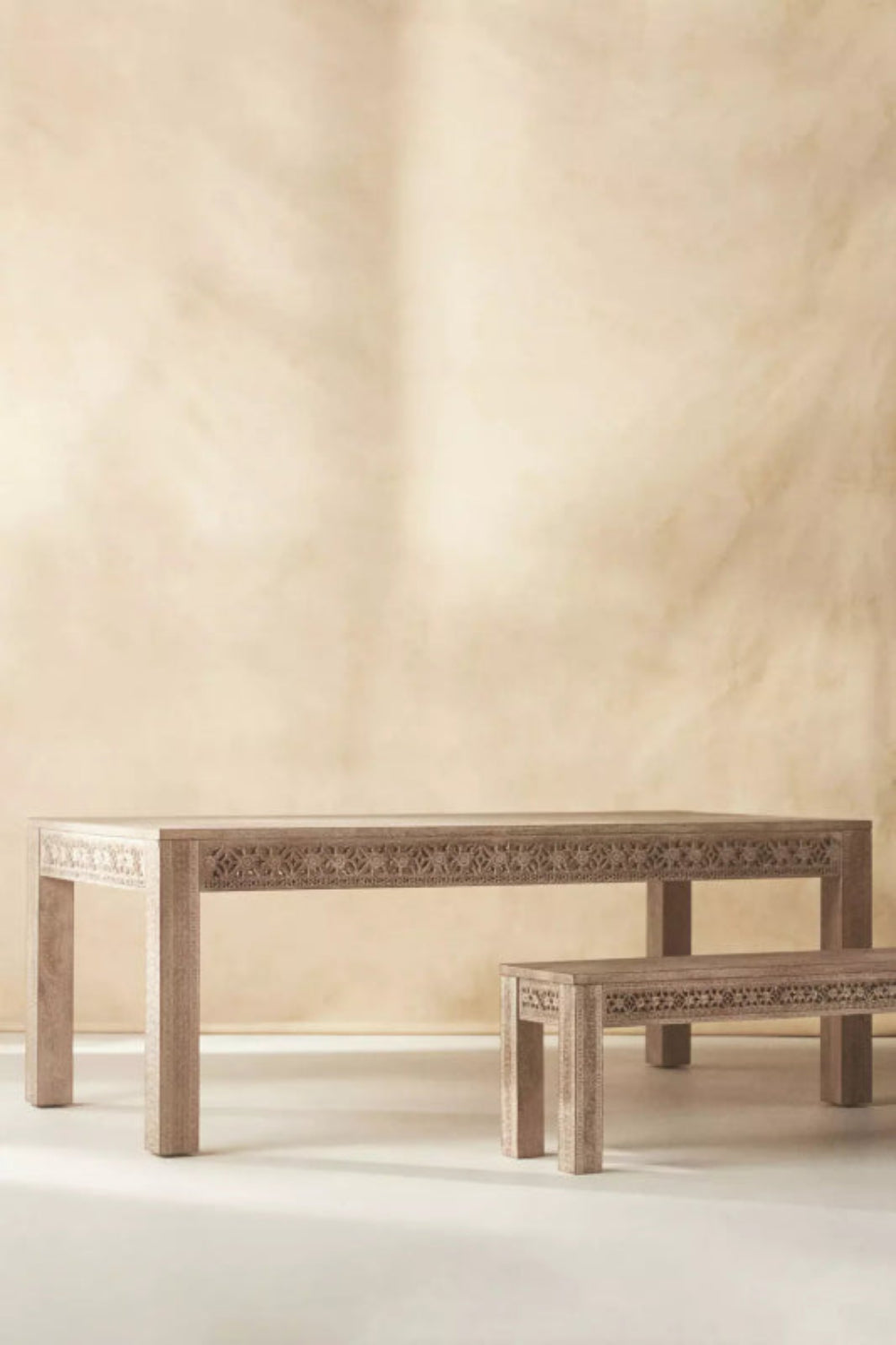 Light wood refectory table with matching bench, front view on a plain white background.