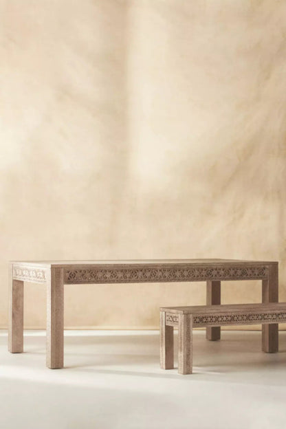Light wood refectory table with matching bench, front view on a plain white background.
