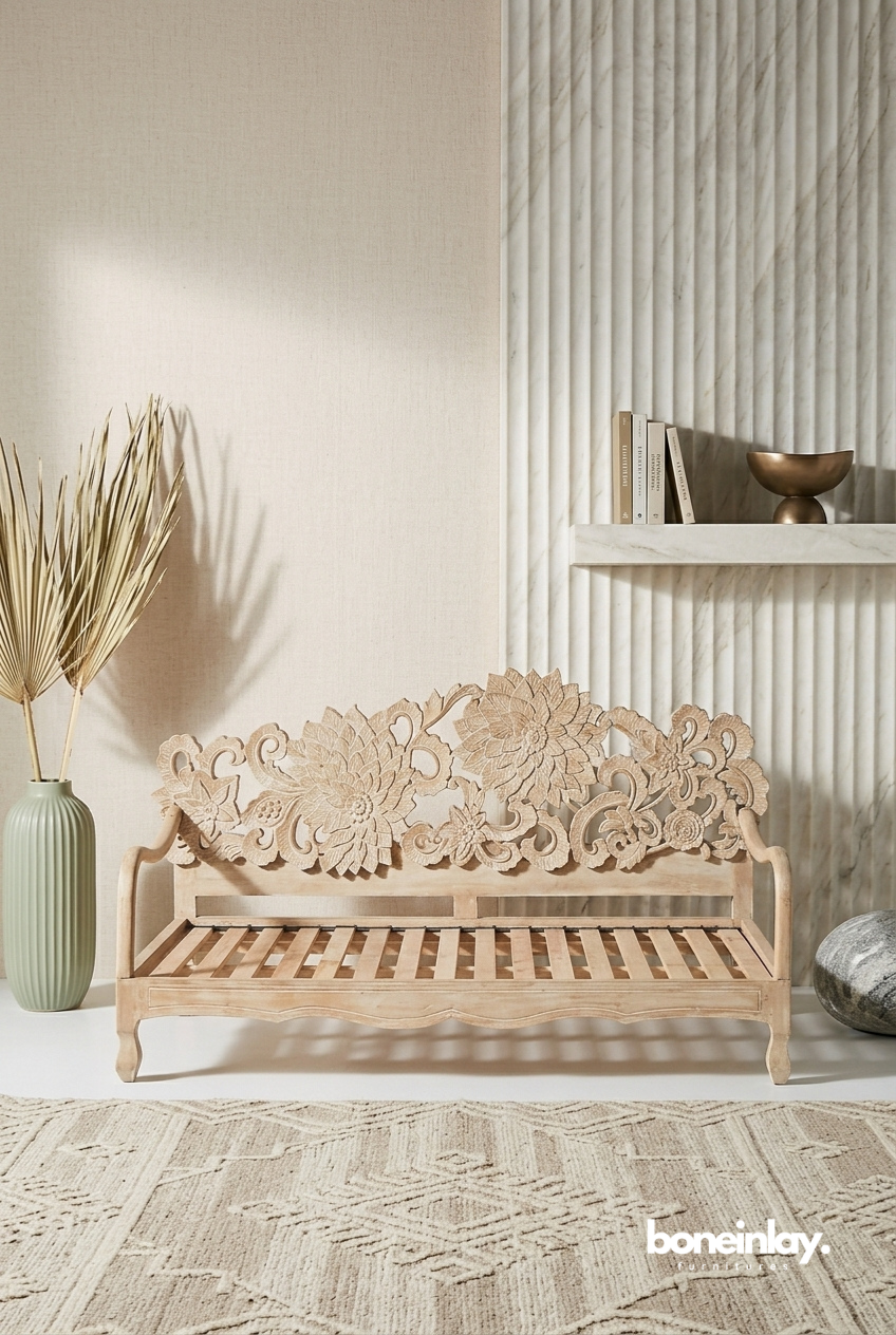 Lotus daybed made of light-toned solid wood featuring an expansive, intricate hand-carved floral backrest in a neutral, sunlit living space.
